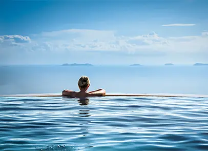 Woman Relaxing in a Luxurious Pool